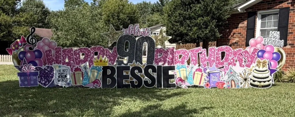 Spell It Out Co Nashville | Birthday Yard Signs & Big Yard Greetings 1 Colorful 90th birthday yard sign display for Bessie featuring personalized letters, balloons, gifts and birthday decorations by Spell It Out Co Nashville.